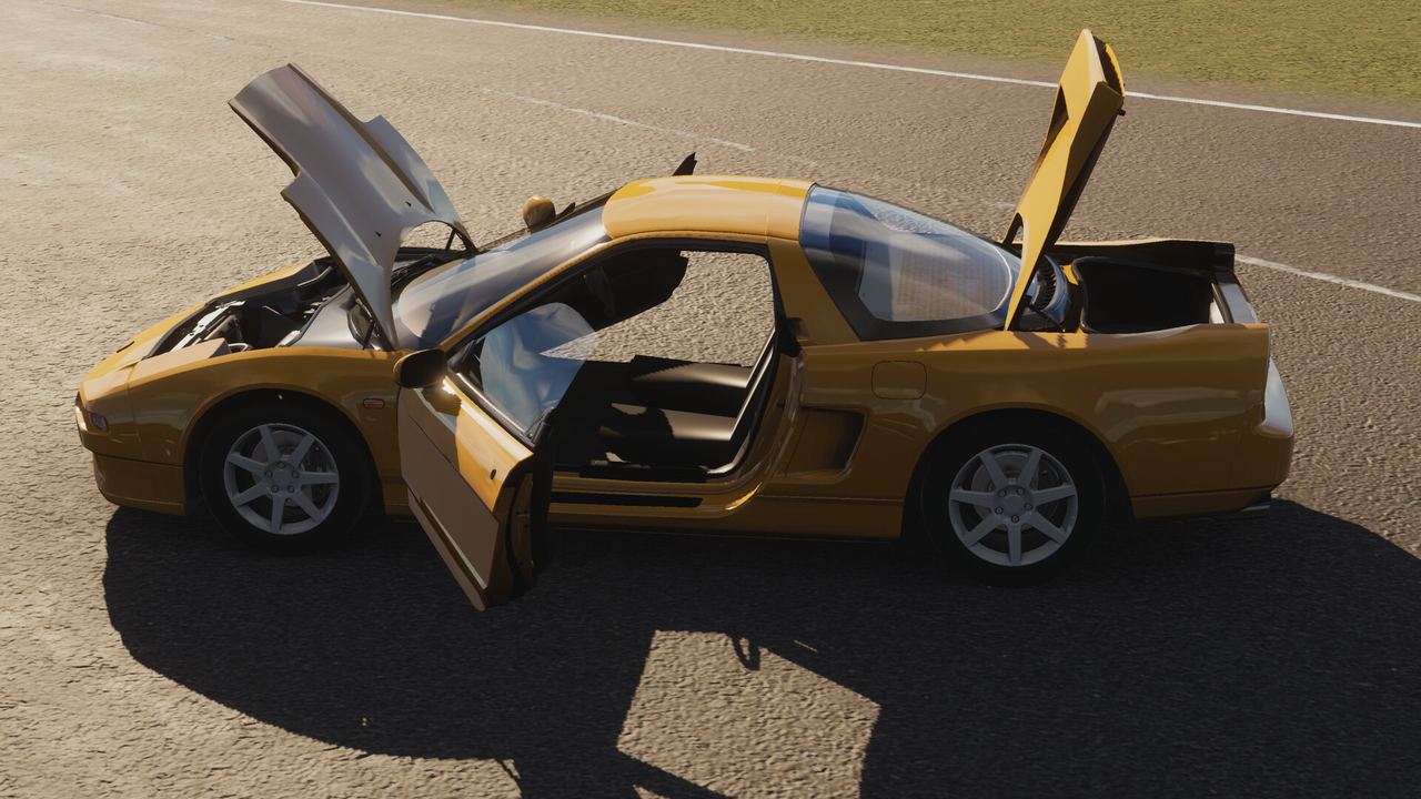 Sports car with doors and panels open